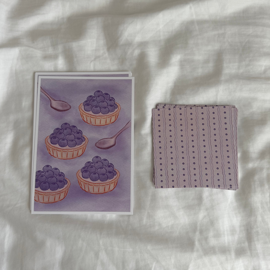5x7 art print of four blueberry fruit tarts and two spoons and a matching 4x4 art print in purple tones.