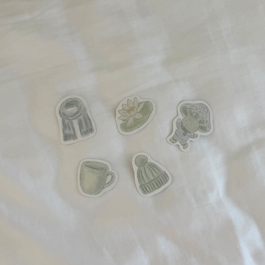 Set of five green and gray illustrations on a white fabric background