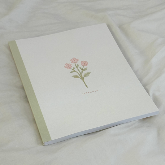 green & pink composition notebook
